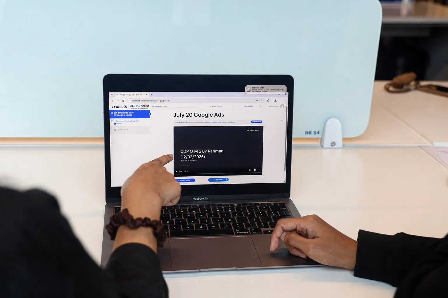 Learner accessing course resources on a laptop